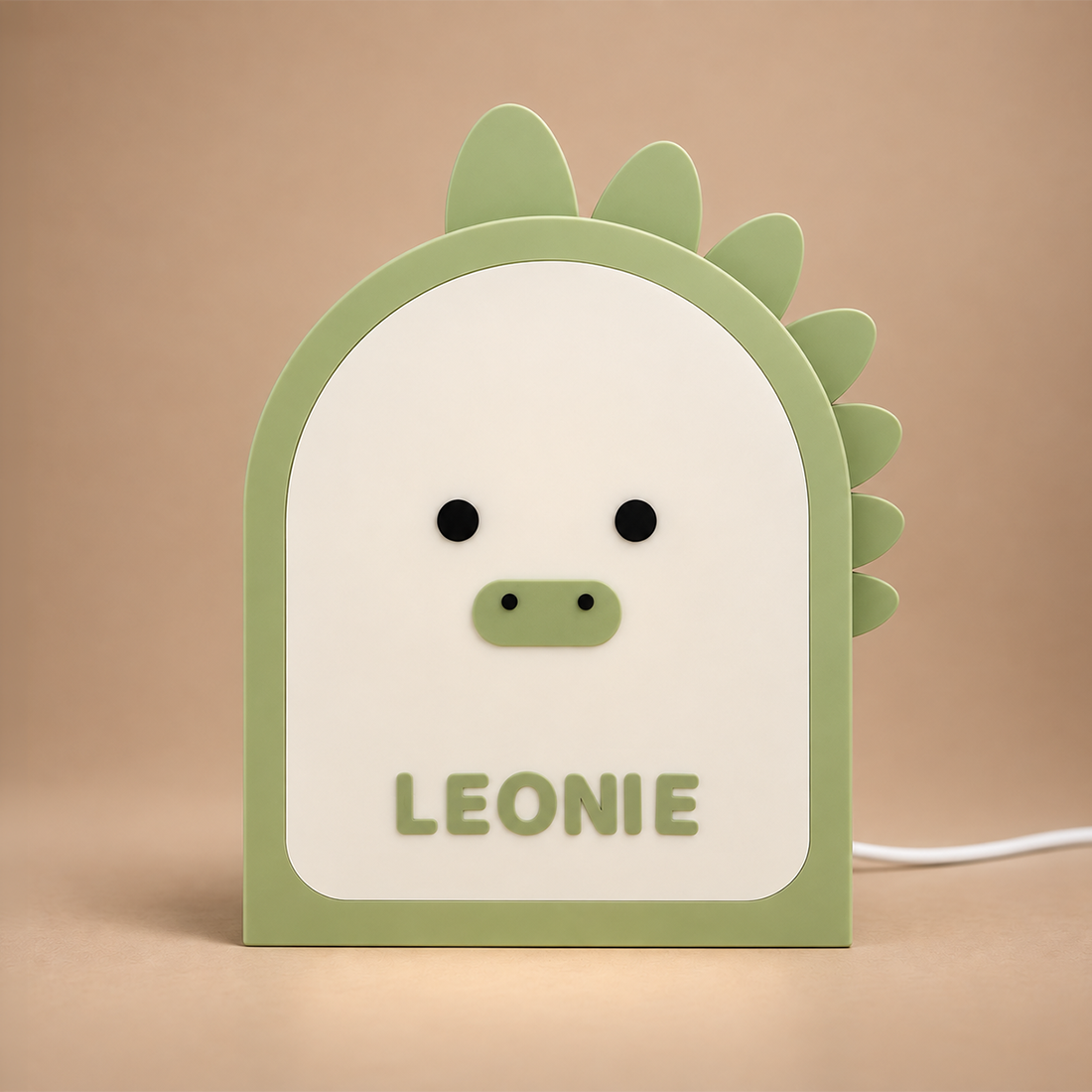 Veilleuse dinosaure en vert sauge, lumière éteinte le jour